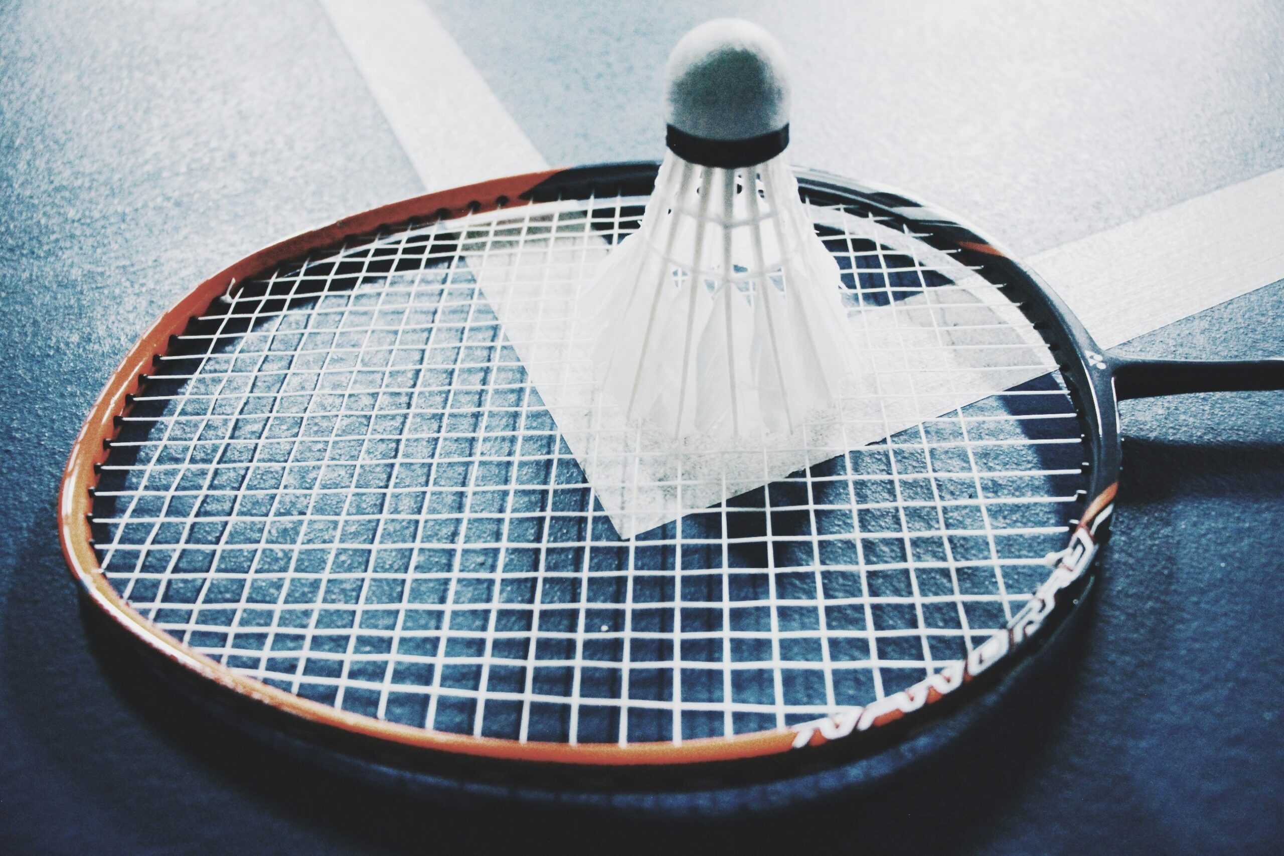 Mastering the Game: The Perfect Blend of Badminton Racquets and Soccer Shoes